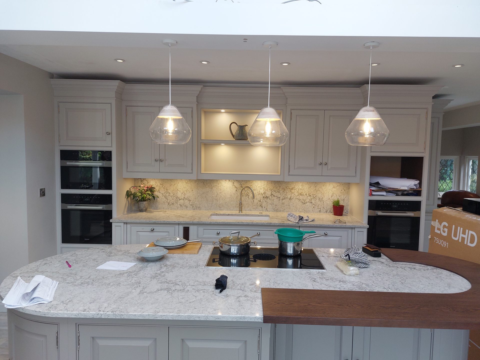 Finished kitchen with pendant lights and downlights after a full house rewire