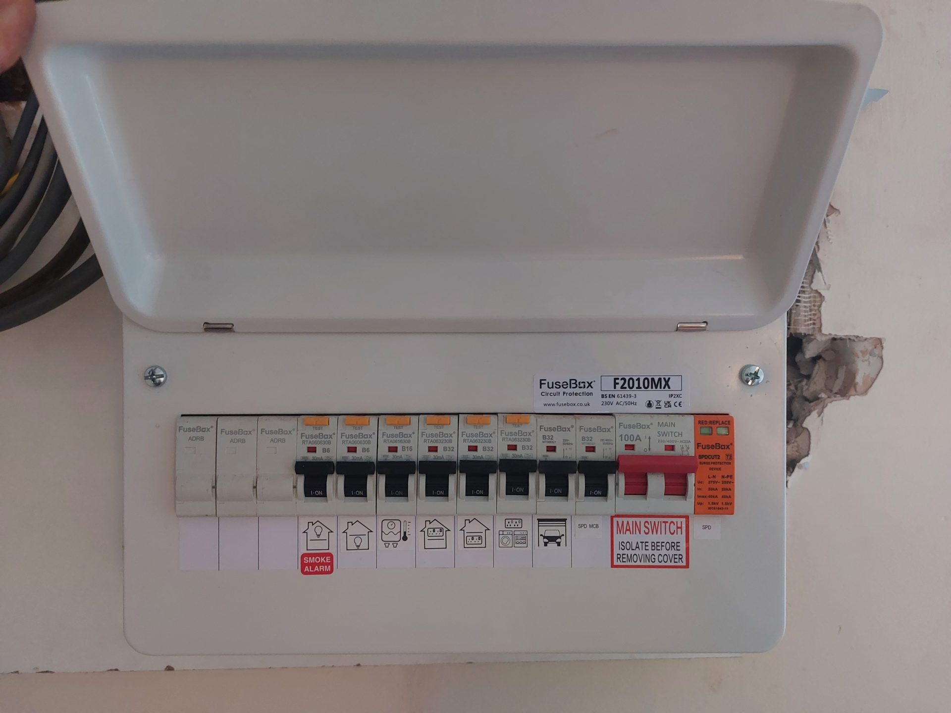 New FuseBox consumer unit installed on a wall with labelled circuit symbols
