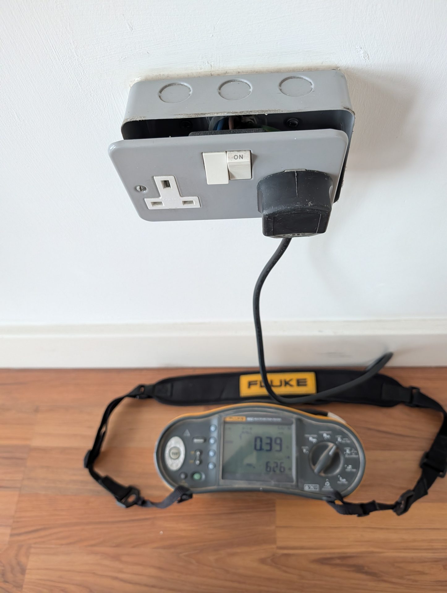 Fluke multifunction tester used for electrical fault finding in Nottingham on a socket