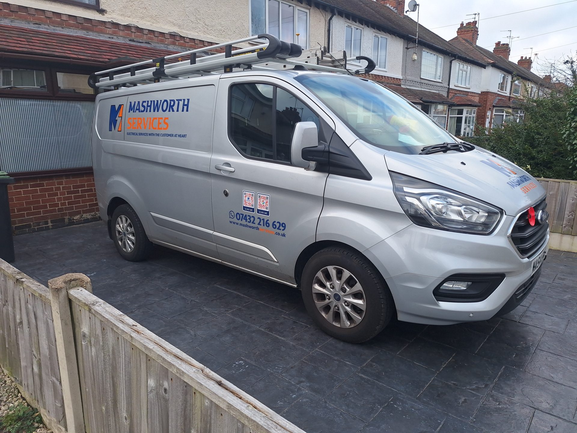 Mashworth Services van parked outside a property during an electrical safety inspection
