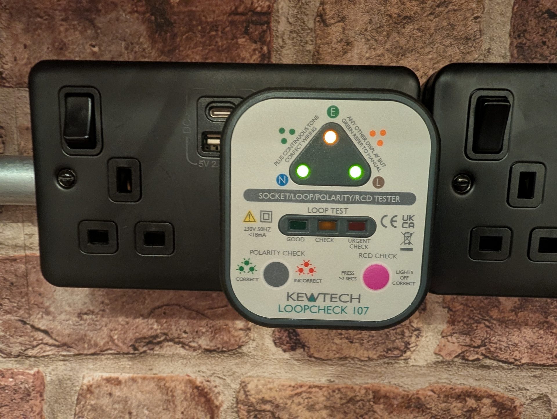 Kewtech socket tester showing polarity and loop results during a fault finding visit