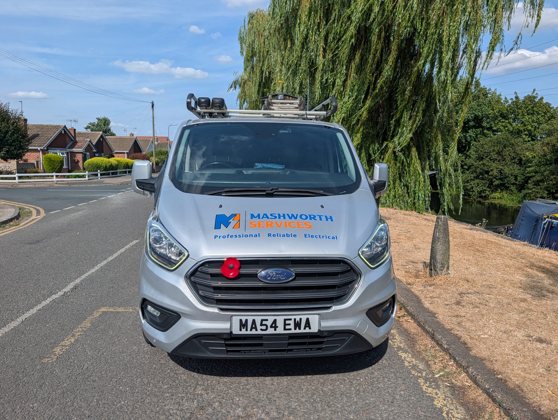 Front-facing Mashworth Services electrician van with branded bonnet and roof equipment